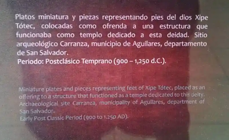 Cross on miniature plates representing Xipe Totec, an Aztec god.